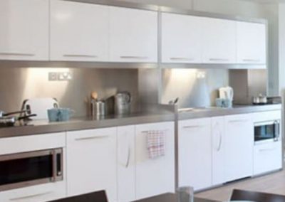 Duo of Frame Module Steel Kitchens In White.