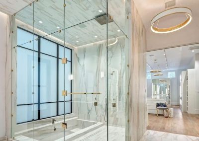 Glass Shower Room With Sunken Bath And Marble Interiors Decor.