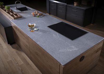 Light Latin Grey Stone Topped Kitchen With Timber Finishing.
