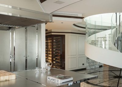Traditional Finished Steel Kitchen Island & View To White Painted & Glazed Wine Cabinetry.