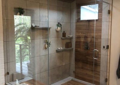 Glazed Glass, Tile and Vaneered Look Shower room.